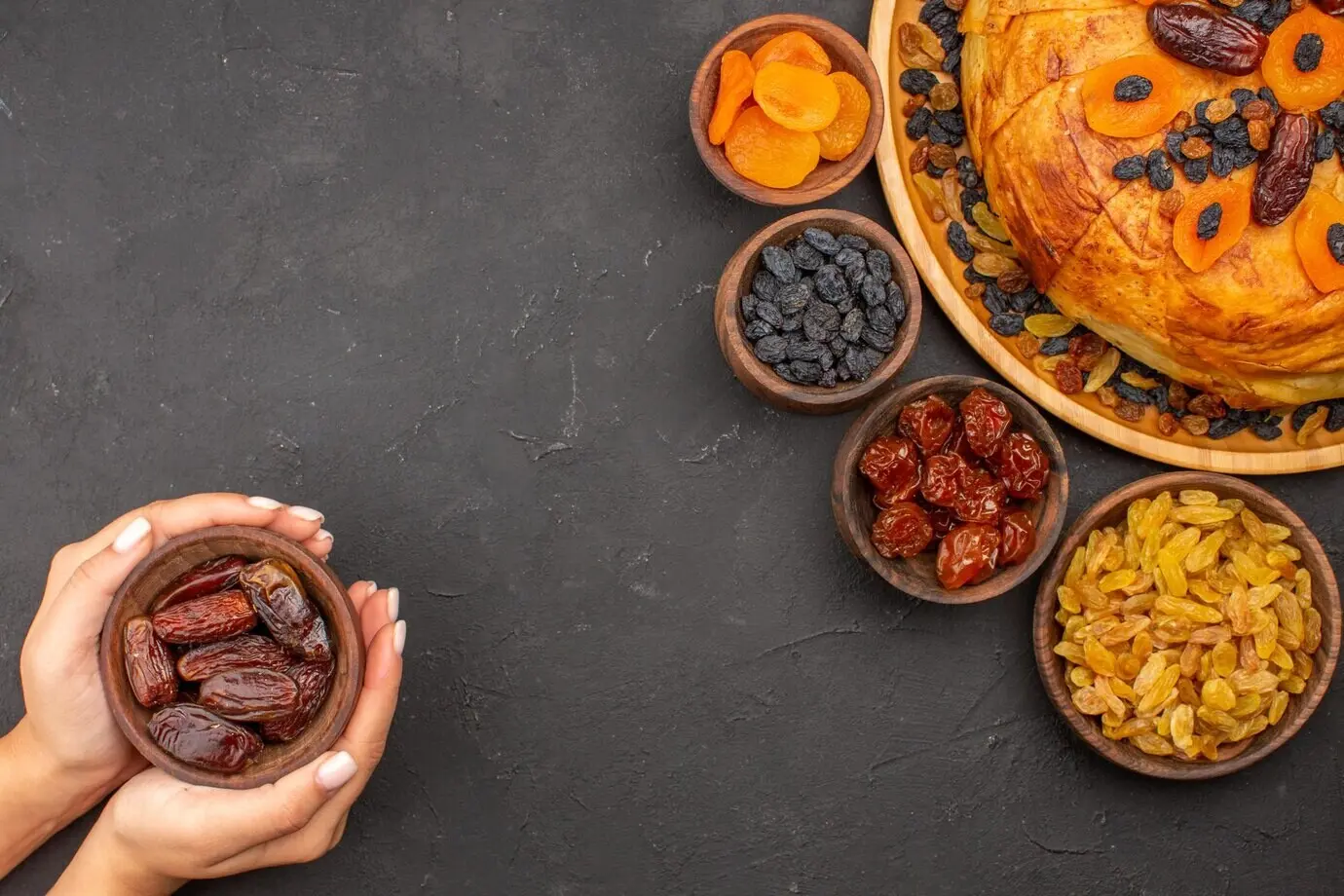 Overhead view of delicious shakh plov with raisins on a grey surface