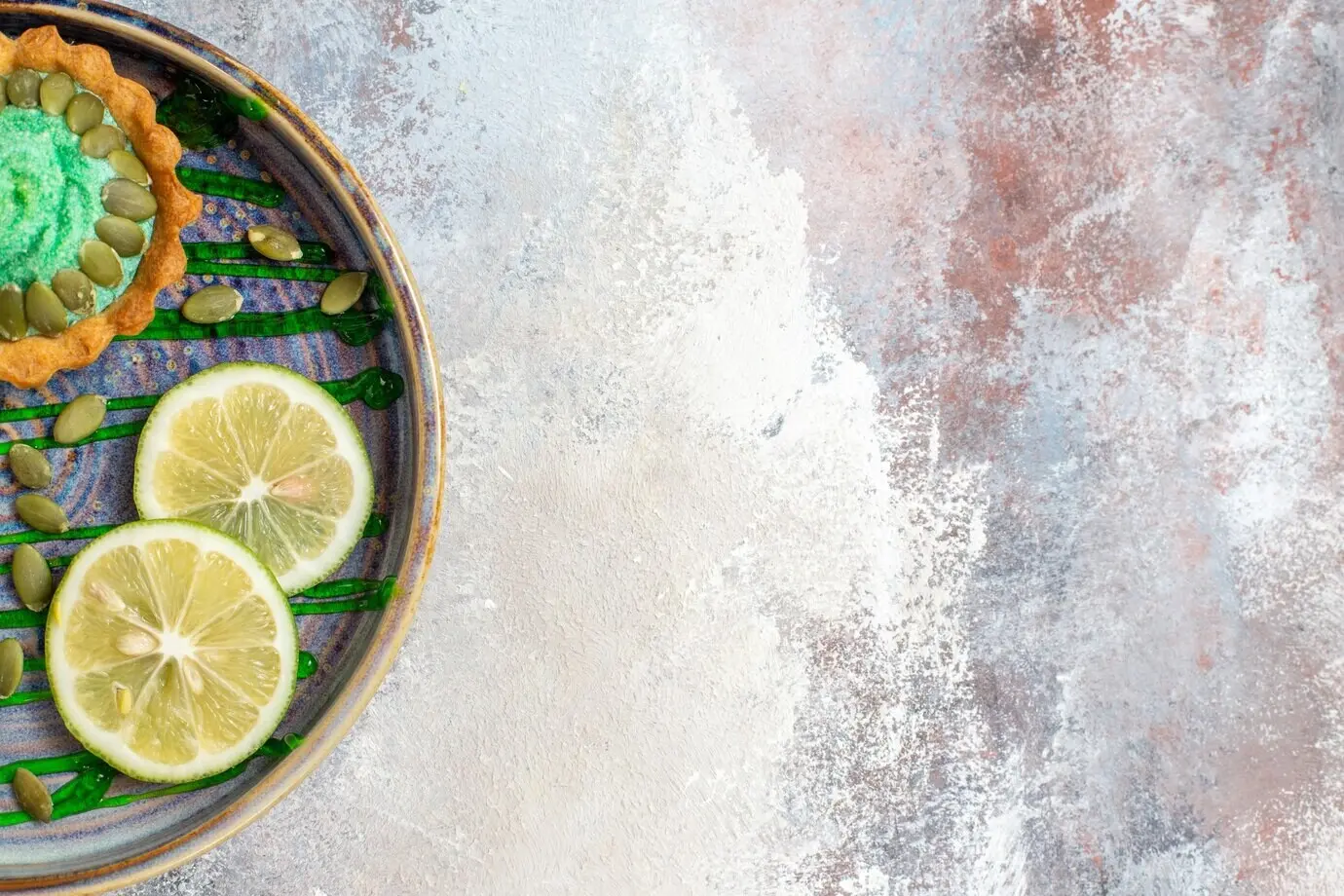 Top view of a little creamy cake with fruits inside, in a tray.